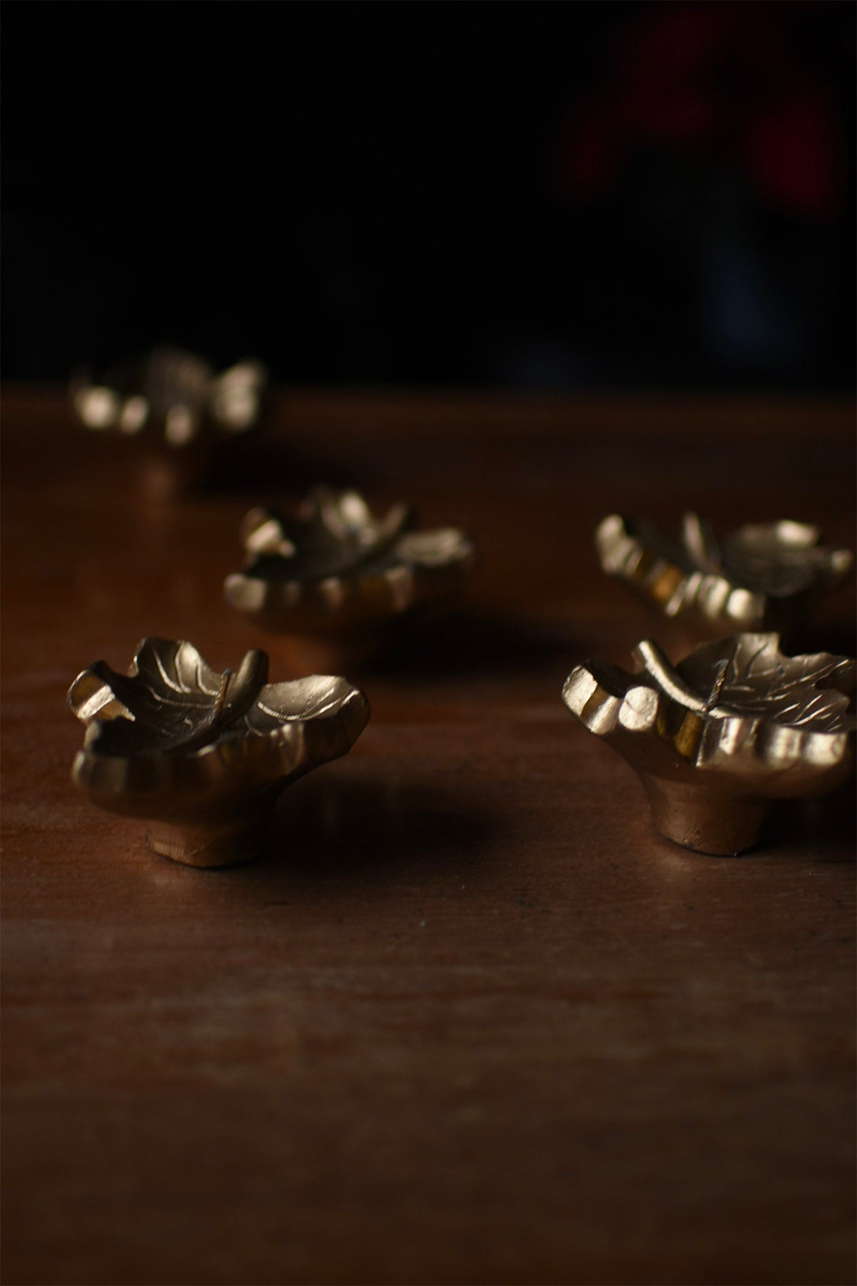 A Set Of Leaf Shaped Gold Candles